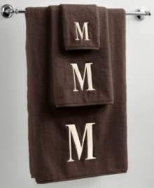 Dry off in your signature style with monogrammed towels from Avanti. Embroidered with a single capital letter in Bodoni font, this mocha and ivory towel set makes it easy to personalize your bath.