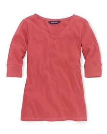 A soft ribbed cotton jersey top is updated with lace trim and a ribbon accent at the neckline.