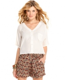 Modernize your warm-weather gear with this asymmetrical, back cutout blouse from Jessica Simpson!