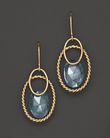 Faceted blue topaz adds rich sparkle to links of 14K yellow gold. By Nancy B.