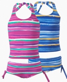 Whether it's training for the race or enjoying the sun and the surf, this Nike halter tankini with matching bottoms give her a sunny style.