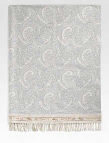 A stunning addition to any home in soft, lightweight wool that's embroidered by hand with a delicate paisley pattern. Fringed ends 55 X 71 Wool Dry clean Made in Italy 