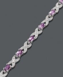 Regally stylish. Victoria Townsend's unique crisscross bracelet incorporates oval-cut amethyst (3 ct. t.w.) and sparkling diamond accents. Crafted in sterling silver. Approximate length: 7-1/4 inches.