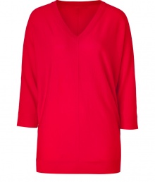 Paint bright color into your chic knitwear collection with DKNYs radiant red pullover - V-neckline, 3/4 sleeves, front and back seams, fine ribbed trim - Long, lean fit - Wear with favorite skinnies with sleek ankle boots