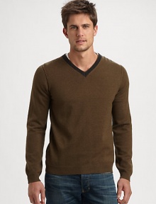 Contrast trim along the neckline defines this essential pullover sweater, shaped in a sumptuous wool blend.V-neckRibbed knit cuffs and hem50% wool/25% camel hair/25% nylonHand washImported