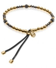 Go for the bold with this stretch bracelet from Michael Kors. Crafted from gold and hematite ion-plated mixed metal, the bracelet dazzles with fireball beads adding luster. Approximate diameter: 2-1/4 inches.