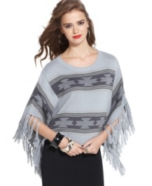 Material Girl's blanket-style poncho sweater adds an exotic touch to any outfit. The fringe trim gives it plenty of movement, too!