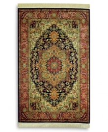 A beautiful example of traditional heriz designs, this rug features a bold navy center medallion surrounded by intricate florals in lighter shades of red and green. The combination of graceful lines and geometric shapes creates an exquisitely balanced pattern. Each color is individually skein-dyed for jewel-tone clarity. A patented wash process creates a vintage finish faithful to the craftsmanship of the original. Woven in the USA of premium fully worsted New Zealand wool.