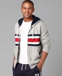 A dose of nostalgia in a bold bar stripe, this Tommy Hilfiger hoodie shows an iconic trio of hues.