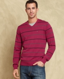 Heat up your cool-weather look with this sharp striped sweater from Tommy Hilfiger.