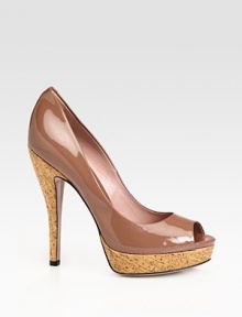 Patent leather open toe silhouette with a cork heel and platform. Cork heel, 5¼ (130mm)Cork platform, 1¼ (30mm)Compares to a 4 heel (100mm)Patent leather upperPeep toeLeather lining and solePadded insoleMade in Italy