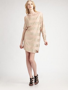 Thick stripes of sparkling studs punctuate this asymmetrical frock.Asymmetrical sleeves Right slit shoulder About 34½ from shoulder to hem Modal; hand wash Imported