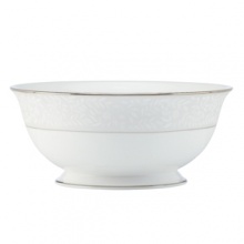 Delicate vines unfurl on soft pewter in the aptly named Sheer Grace serving bowl from Lenox. Lustrous white porcelain and bands of sparkling platinum ground the look in understated splendor. Qualifies for Rebate