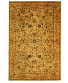 Lavish your space in timeless tradition, set in soft shades of sage on this exquisite area rug from Safavieh. Tufted in India from pure wool, this rug emerges from the annals of antiquity to bring spectacular style and time-honored quality to your home. (Clearance)