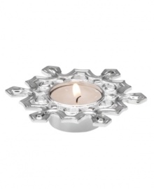 Let it snow! This carved snowflake votive candle holder from Lenox offers a charming way to decorate any home for the holidays. Qualifies for Rebate