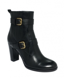 A duo of buckled straps stands out against the dark leather upper of Tahari's Robyn booties.