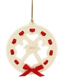 All wrapped up in a holiday bow, this graceful wreath ornament makes a memorable gift for 2012. With carved candy canes, holly and pretty scrolling detail in Lenox porcelain.