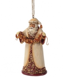 Dressed – not in his traditional red and white getup – but in a beautiful coat of ivory, burgundy and gold, this Santa ornament from Jim Shore makes for a memorably elegant tree.