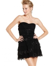 Dare to dazzle in this little black party dress from Roberta! Fluttery tiers and sequin accents add fun style to a seriously hot frock.