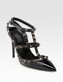 Signature metal studs enliven this lifted point toe silhouette in glossy patent leather. Self-covered heel, 4¼ (110mm)Patent leather upper with metal studsPoint toeAdjustable ankle strapLeather lining and solePadded insoleMade in Italy