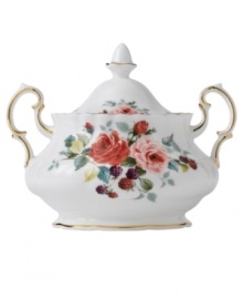 Steeped in tradition, the Rosa sugar bowl by Royal Albert combines elaborate blooms in fine bone china. An old-world, double-handled design with dainty ruffled edges and bands of gold exudes traditional English opulence.