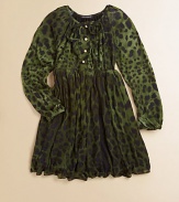 Long-sleeved, knit frock adorned with a bold leopard print and finished with pearl-like buttons and a full skirt.Round neckline with tieLong sleevesFront buttonsElastic waistbandFull skirtModalMachine washImported Please note: Number of buttons may vary depending on size ordered. 