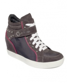 Get ready for the limelight. G by GUESS' Pop Star wedge sneakers feature stud detailing and a Velcro strap across the lace-up vamp.