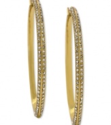 Go big and bold. These hoop earrings from Vince Camuto are crafted from gold tone mixed metal and feature rows of clear glass accents adorning the outside. Approximate drop: 3-1/4 inches.