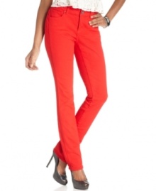 Clever side seams fool the eye in this completely flattering denim look from DKNY Jeans. In fashion-forward red, these petite skinnies make a chic statement.