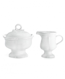 Gently scalloped detail in hardy stoneware gives the French Country creamer and covered sugar bowl an effortless grace that's ideal for every day. From Mikasa.