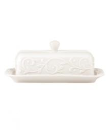 With an elegant white-on-white pattern featuring an embossed vine motif and radiant glaze, the Opal Innocence Carved covered butter dish gets your table set for refined dining every day.