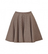 For a modern riff on classic equestrian chic, try McQ Alexander McQueens elegant cotton and wool blend swing skirt - In a traditional brown houndstooth pattern - Gently pleated, A-line cut hits above the knee and bells at hem - Slim waistband and back zip - Pair with a classic white button down or cardigan and platform pumps or ankle booties