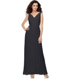 Suzi Chin's floor-length dress evokes glamour that knows no era. Soft pleats and a seamed waistline create a fabulously flattering fit.