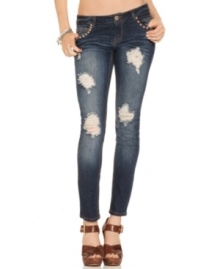 Looking for a pair of jeans with attitude? Shred detail and copper-tone studs pump-up this skinny leg style with tough-girl flavor! From Tinseltown.