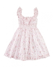 A charmingly traditional dress in crisp cotton with a floral pattern has pretty ruffles and smocking details for a sweet summer look.