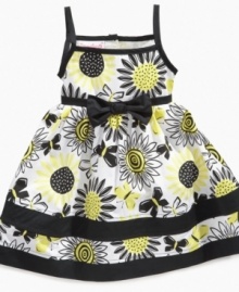 In bloom. Her beauty will shine through in this eye-catching sundress from Nannette.