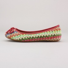 Slip on these woven ballerina flats for a fun and laid back look this summer. Features a woven textile upper, slip-on style & braided bow-tie detail on the toe. Imported.