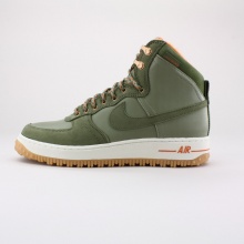 The Nike Air Force 1 High DCNS Military Boot keeps impressing with a range of muted colorways, this Silver Sage and Medium Olive combo getting a bunch of help from orange accents including the lace ticking, as well as buffalo plaid sockliners, brass eyelets and gum rubber on the toothy traction setup. Imported.