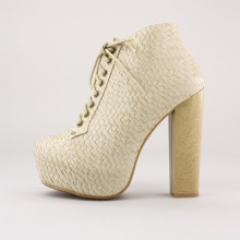 This concealed platform heel has an embossed weave design along the upper and a simulated wood balance to compliment the color and tone of this unique shoe.