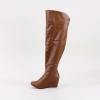 When cold weather hits, slip on these knee high wedge boots from Bamboo. Features a synthetic leather upper, round toe front, slightly slouchy design and 3"  wedge heel. Measures with a 23.5"  shaft height (including heel). Imported.