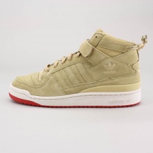 The Forum and its revolutionary ankle-strap design made basketball shoe history when it first graced the court in 1984. These adidas Forum Mid shoes give the classic a sporty look with suede leather.