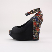 Make a style statement with these platform wedges. Features a faux leather & floral printed textile upper, adjustable ankle strap, peep toe, 1.5"  hidden platform & 5.5"  heel. Imported.