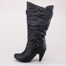 This banana heeled boot speaks for itself in pictures. Multiple buckle details and a tall shaft really sets this boot off.