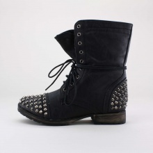 Give yourself the rugged look of a bad biker chick with these stylish boots. Features a leatherette upper, lace-up front, side zipper entry and spiked studs on the toe and heel. Imported.