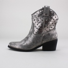 Step out with some western flair in these stylish cowboy style ankle booties. These women's boots feature a distressed synthetic leather upper with pointed toe, side pull-loops, rhinestone & studded embellishments and a 2.5"  heel. Imported.