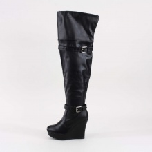 This sleek and stunning thigh high wedge boot will heighten your fabulous style. Featuring round toe front, wrap-around buckle strap on shaft, slightly slouchy design, 1.5"  platform, 4.5"  wedge heel. Measures with a 26"  shaft height (including heel). Imported.