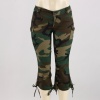 These women's camoflage cargo capri pants are vintage styled and military inspired. Features a low rise cut, 4 button-closure pockets, zipper fly & tie strings at the bottom of the legs. 55% Ramie, 43% Cotton, 2% Spandex. Machine Wash. Imported.