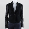 Find yourself in style with class with this high fashion women's blazer. This blazer features a jersey knit with vegan leather long sleeves and waist accent, classic blazer construction, single button tab closure at front and double waist pocket décor. Finished with a striped lining. 100% polyester, machine wash - imported.