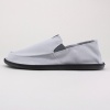 The perfect warm-weather canvas slip-on houses a soft solar foam midsole and outsole. With a laceless design, a stitched Nike logo is on the vamp. Imported