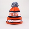 Keep warm and in style with this team color striped, cuffed knit cap. Features include a (raised) embroidered Miami Dolphins team logo at front, a stitched New Era® flag at wearer's left side, and a stitched namesake across the top of the front. Cap features plush pom-pom at top. 100% acrylic - imported.